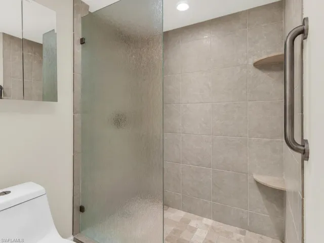 Bathroom featuring toilet and walk in shower