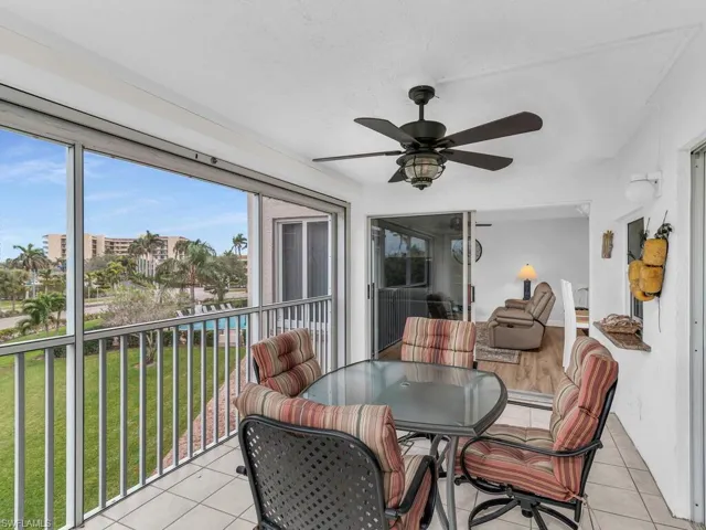 Sunroom featuring ceiling fan