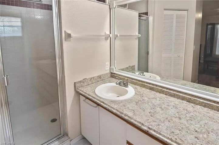Bathroom with vanity and walk in shower
