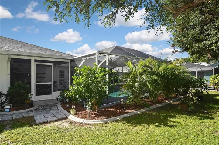 View of yard with a lanai