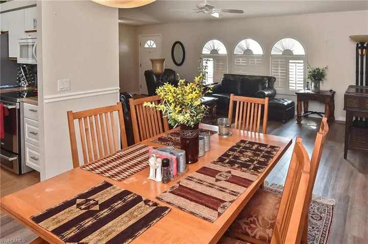 Dining space featuring plenty of natural light, ceiling fan, and hardwood / wood-style floors