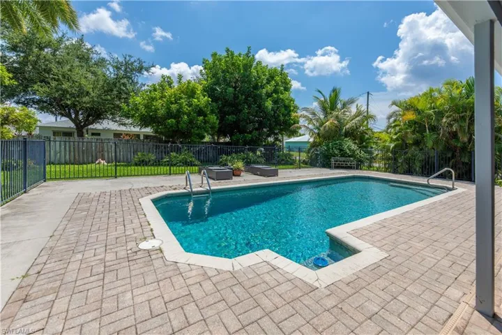 View of pool featuring a patio, a fenced in pool, and a fenced backyard