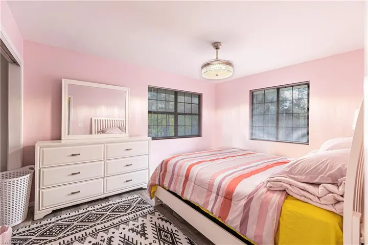 Bedroom with hardwood / wood-style flooring