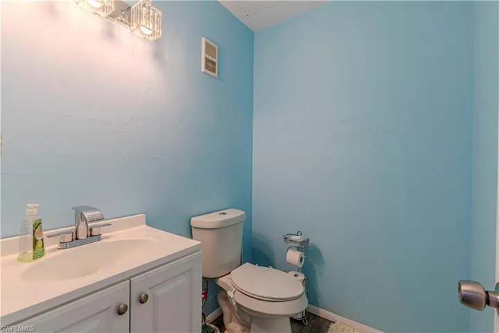 Bathroom featuring vanity and toilet