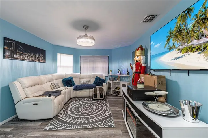 Living room with hardwood / wood-style floors