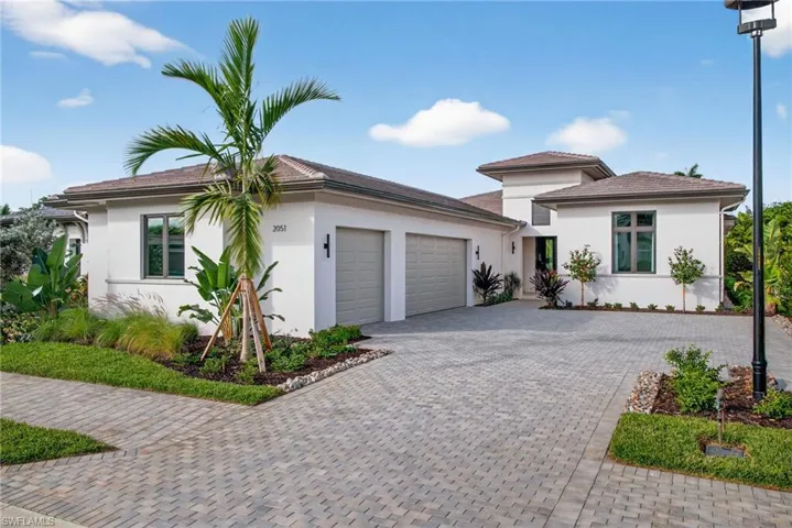 Front view of this boutique home located in the private gated community of Cambridge Park at Orange Blossom