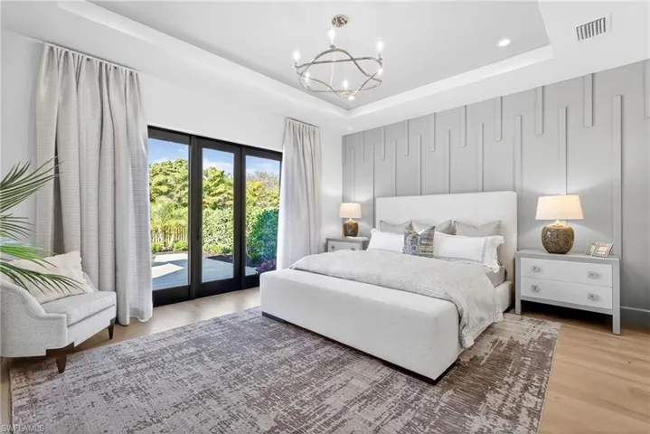 Master suite has plenty of natural light from the large doors which lead to private outdoor patio space.