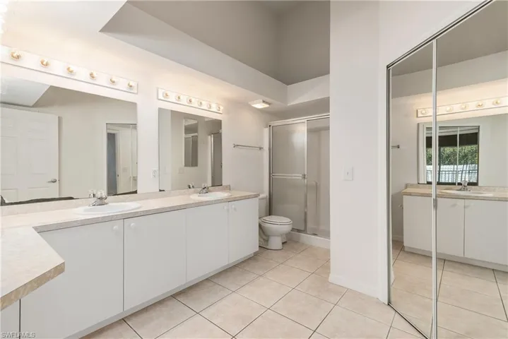 Owner's bath with dual sinks.