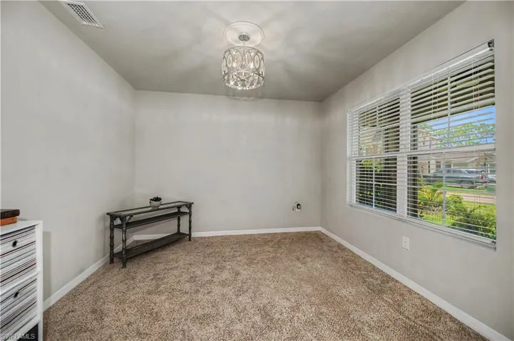 The Den has new carpet and faces the front window of the house with wonderful view of neighborhood street.