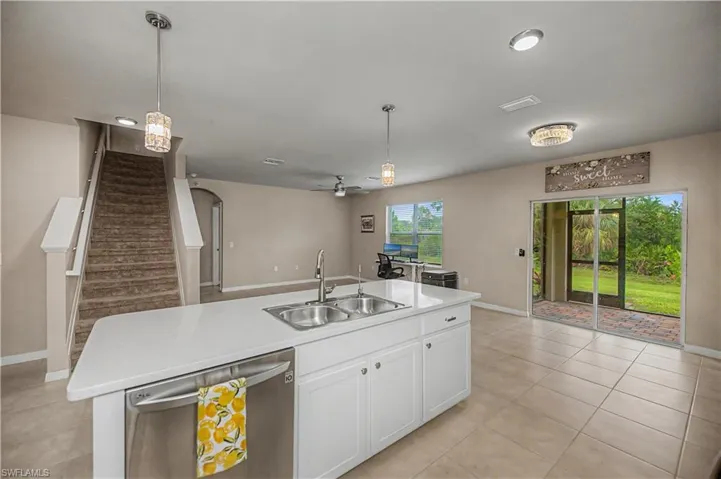 kitchen facing the back sliding windows to the lanai and backyard.