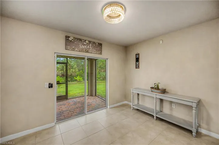 the sliding glass doors that lead to the screened in patio/lanai & larger back yard facing natural preserves!