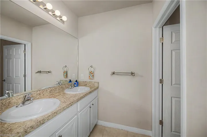 2nd floor bathroom with dual sinks to share