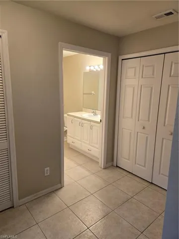 Bathroom with tile patterned flooring and vanity