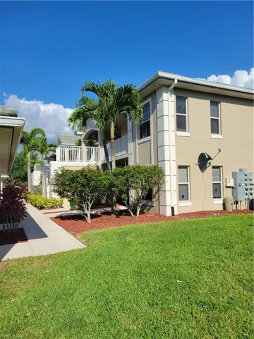 View of yard featuring a balcony