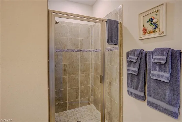 Bathroom with a shower with shower door