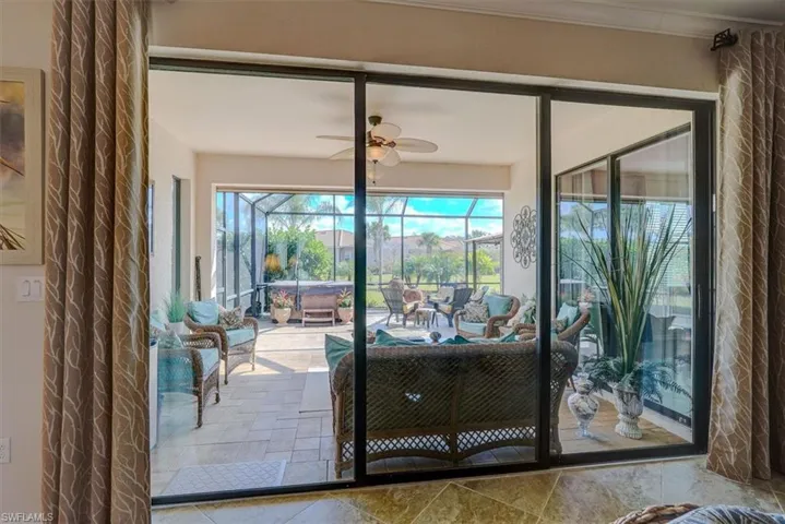 View from sliders inside bedroom to lanai