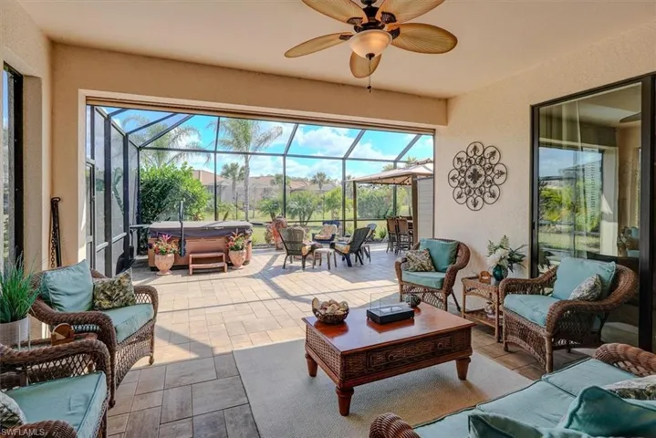 Sunroom with plenty of natural light and ceiling fan