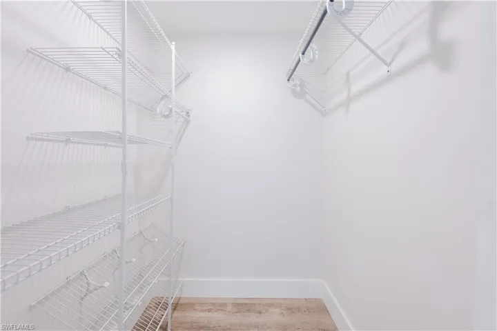 Walk in closet featuring light wood-type flooring