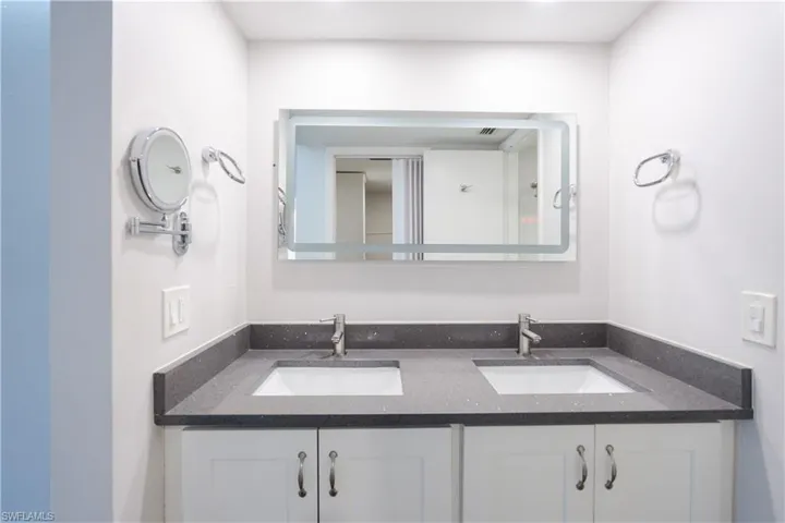 Bathroom featuring double vanity
