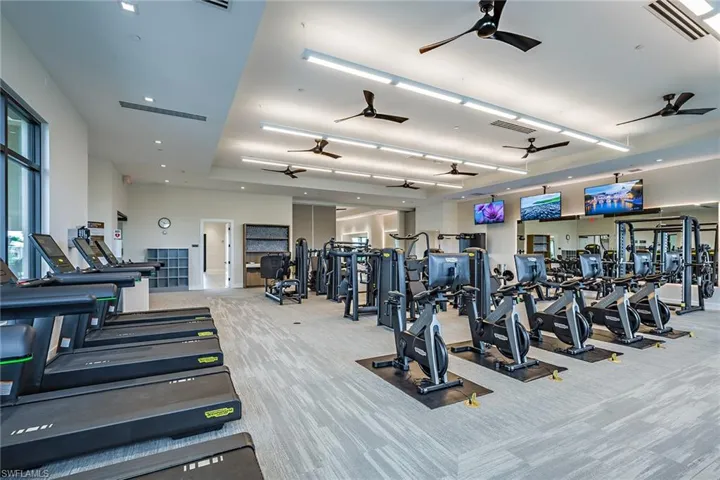 Workout area with light colored carpet
