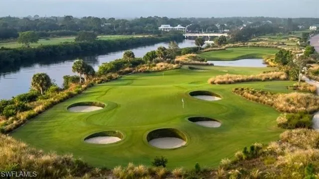 Surrounding community featuring golf course view and a water view
