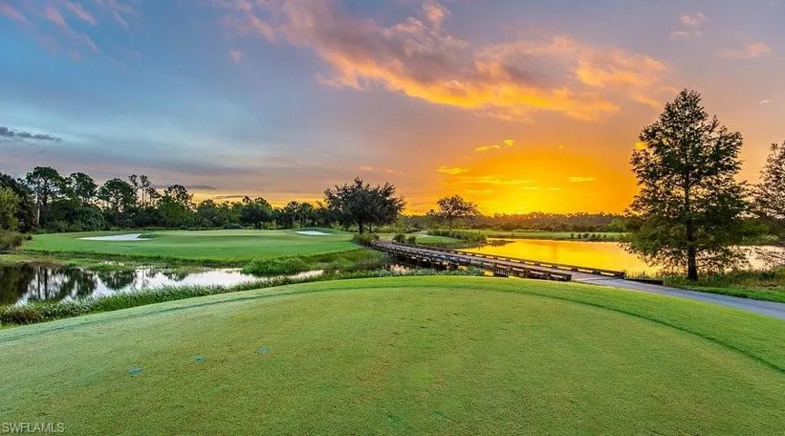 Surrounding community featuring a water view, golf course view, and view of wooded area