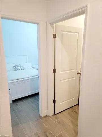 Corridor with wood finish floors
