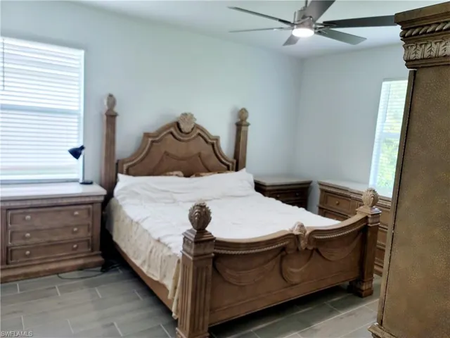Bedroom featuring ceiling fan and wood finish floors