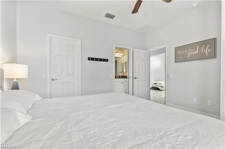 with adjoining bath and walk in closet