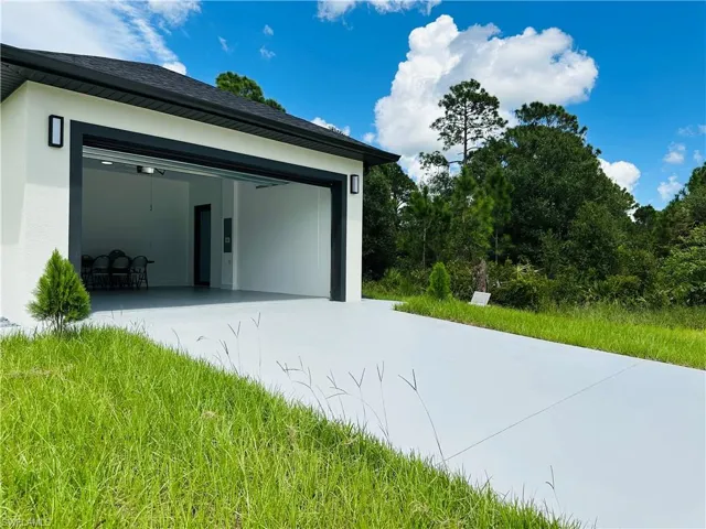 Garage with concrete driveway
