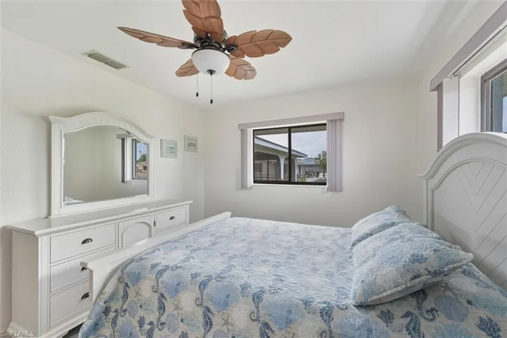 Back Bedroom 2 -  featuring 2 windows, plank flooring and ceiling fan