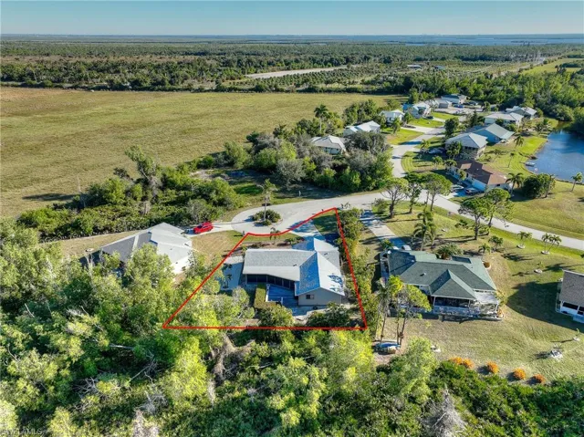 Aerial view of residential area featuring property boundaries highlighted