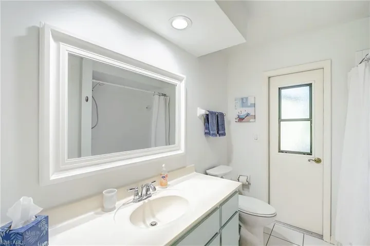 Bathroom featuring vanity, tub and shower