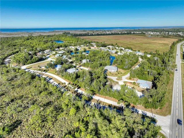 View of property location with nearby suburban area and a nearby body of water