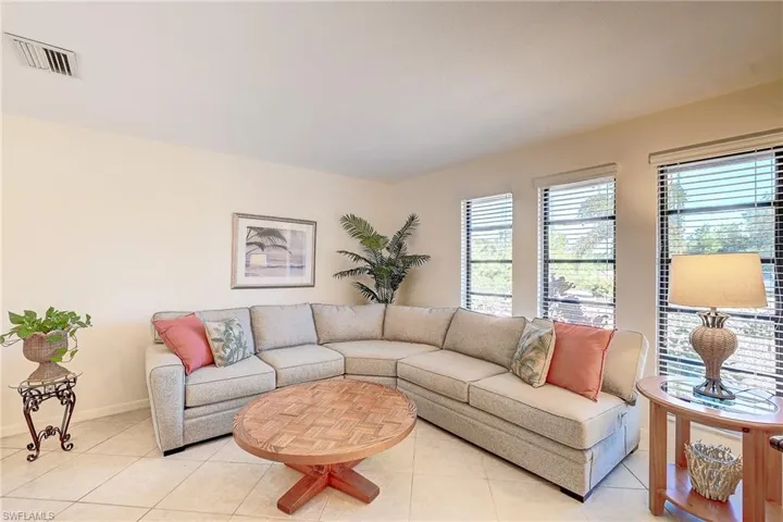 Tiled living room with casement windows