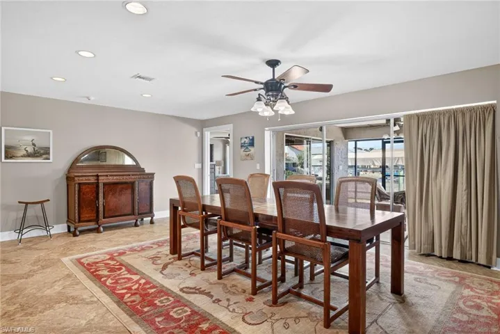 Dining area featuring ceiling fan and recessed lighting