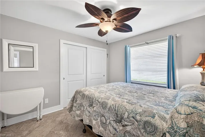 Bedroom featuring a closet and ceiling fan