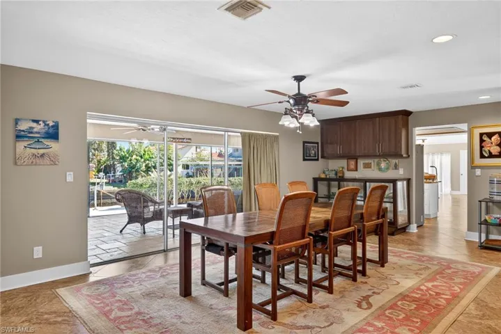 Dining area featuring a ceiling fan and recessed lighting
