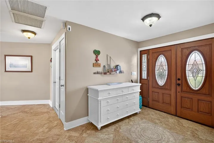 Foyer featuring baseboards