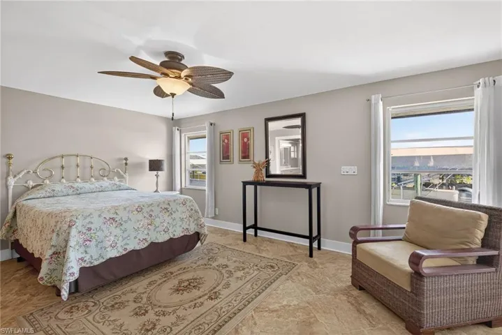 Bedroom featuring baseboards and a ceiling fan