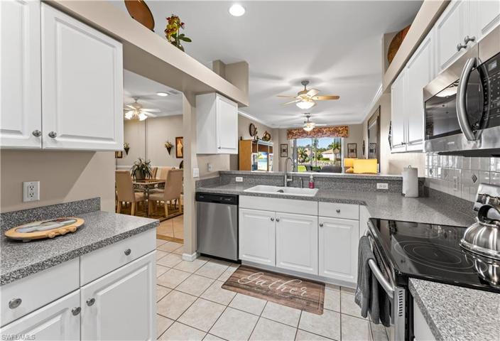 Stainless steel appliances.  Solid surface countertops .