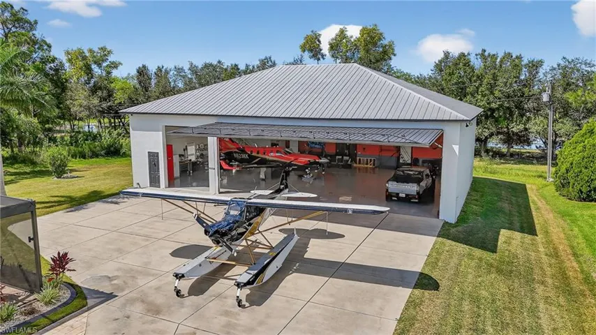 View of patio with a detached HANGAR