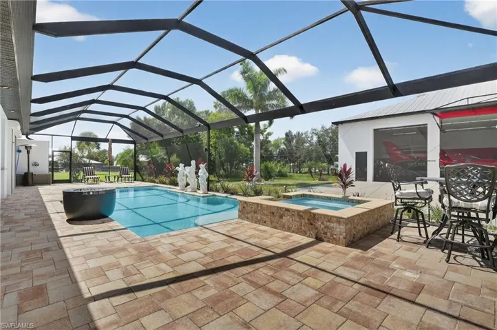 View of pool with a lanai, panoramic pool screen enclosure