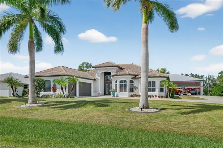 Front entrance with 3 car garage