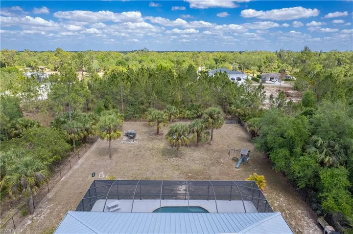 Birds eye view of property with back yard