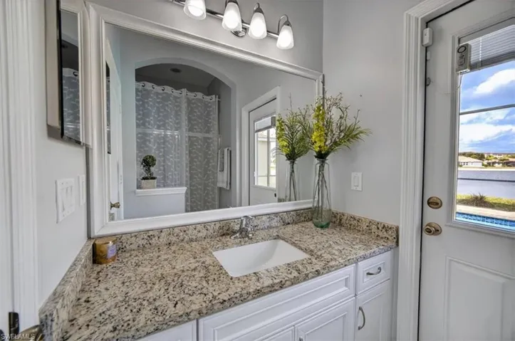Pool Full bathroom featuring shower and vanity