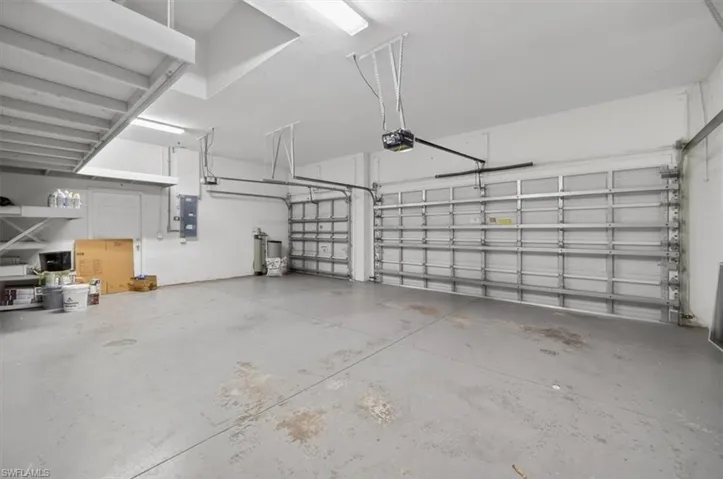 3 Car Garage extra deep with storage shelves and garage door opener
