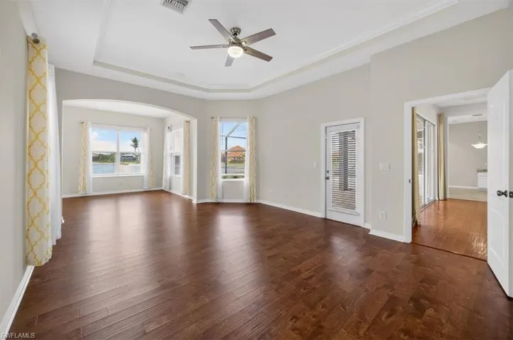 Large primary bedroom with sitting area and access to lanai