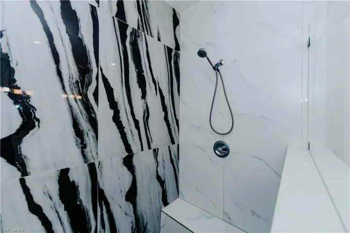 Details with a tile shower