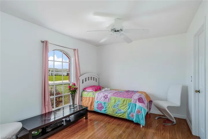 Bedroom featuring ceiling fan and wood finished floors